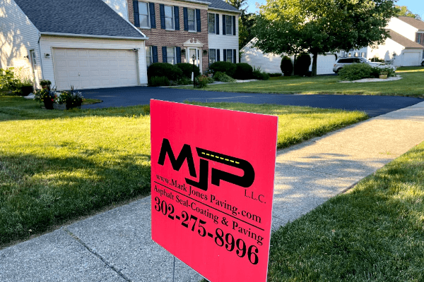 Freshly sealed asphalt surface Freshly sealed asphalt surface